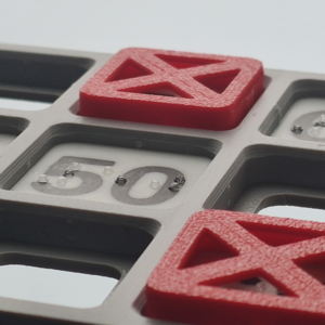 Close-up of a bingo card, showing the braille dots